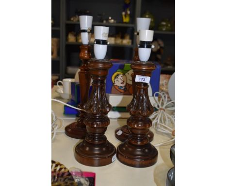 A pair of reproduction Victorian style table lamp bases, each measuring 35cm high, and another pair of laminated wood table l