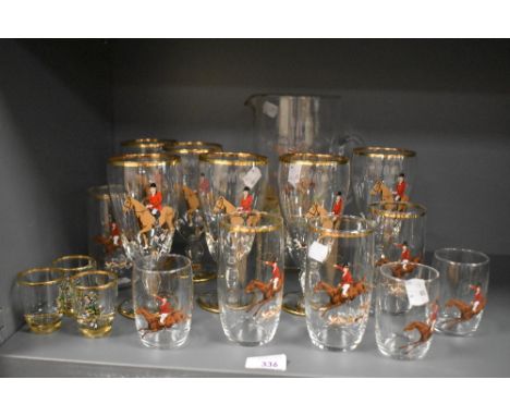A vintage gilt and hunting scene decorated lemonade set and other glasses, to include three Highland Piper shot glasses.