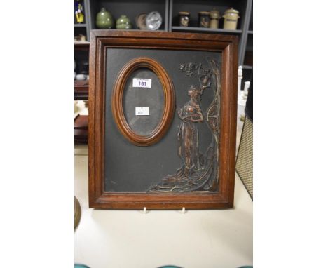 An early 20th Century photograph frame, decorated with a relief moulded Art Nouveau design, measuring 24cm x 36cm overall