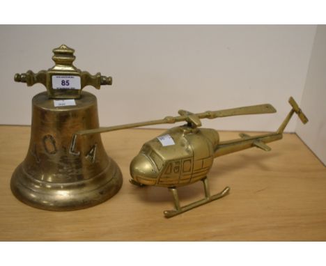 A 19th/20th Century brass ship's bell, engraved 'YOLA', measuring 21cm high, and a vintage brass helicopter