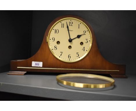 A mid century walnut arched mantel clock, with Arabic hours, marked Kieniger 21cm