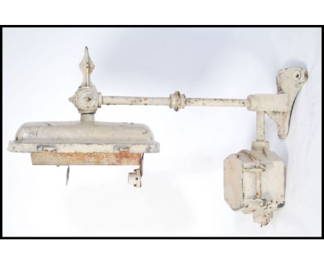A good early 20th century large cast metal street light being wall mounted having a stunning rectangular light fitting on sha