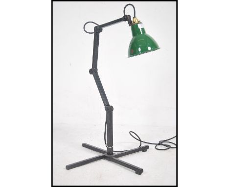 An early 20th century industrial factory wall mounted adjustable Memlite anglepoise light, with the original switch in origin