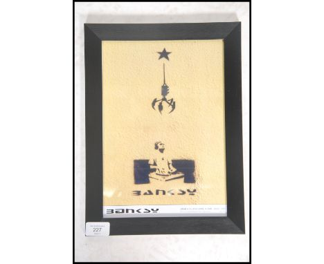 A graffiti urban art print by Bristol Street artist Banksy entitled Grab A DJ And Make A Star 1999  number 4/50 framed and gl