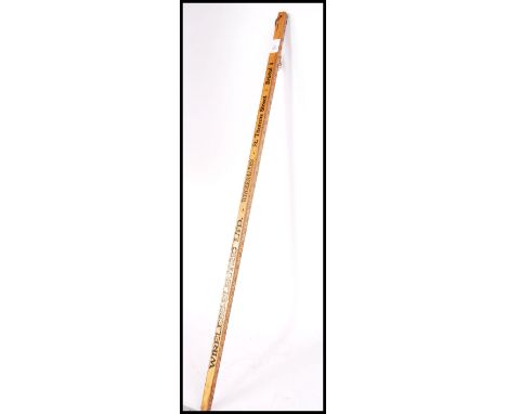 A vintage early 20th century advertising wooden tapering measure pointer stick for Wireless Electric of Thomas Street, Bristo