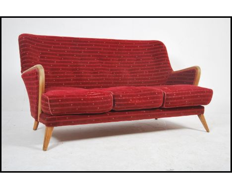 A 1950's / mid century sofa settee by Vesper. The sofa raised on angular tapering beech wood legs with show wood frame uphols