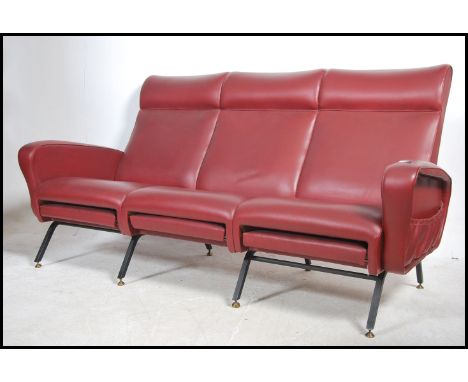 A good 1970's Italian red faux leather upholstered sofa in the manner of Gio Ponti. The upholstered frame in red vinyl with a