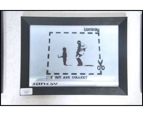 A graffiti urban art print by Bristol Street artist Banksy entitled Cut Out And Collect 1999  number 3/50 framed and glazed o