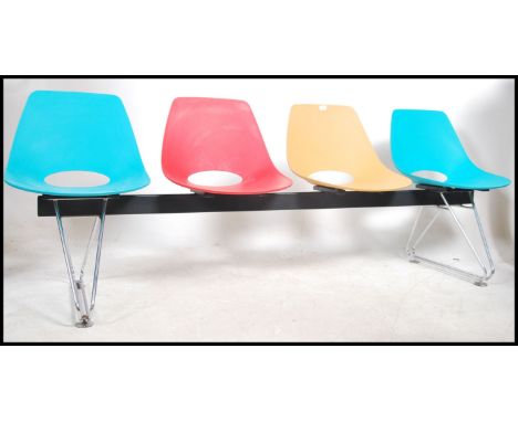 A good late 20th century / contemporary Charles &amp; Ray Eames style 4 seat bench by Merryfair having chrome DSW style eiffe