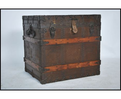 A late 19th Century iron-mounted, wooden bound canvas cabin trunk / steamer chest by The Taylor Trunk Works, Chicago and Illi