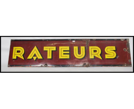 A large vintage early 20th century enamel advertising sign for Rateurs. The sign with purple background and colourful notatio
