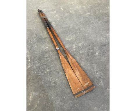 A pair of vintage oars. 71' long