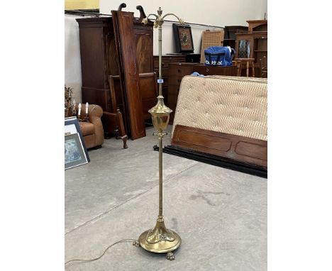 An early 20th century brass telescopic three light lamp standard 