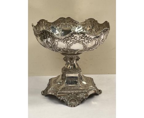 An Edward VII silver comport by Horace Woodward and Co, all-over chased with festoons and garlands of flowers, the stem with 