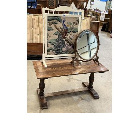 An oak low table; a painted tapestry fire screen and a mahogany dressing table mirror (3)