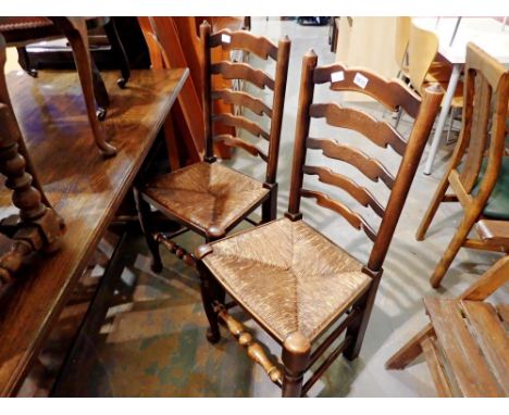 Four oak ladder back rush seated chairs. Not available for in-house P&amp;P 