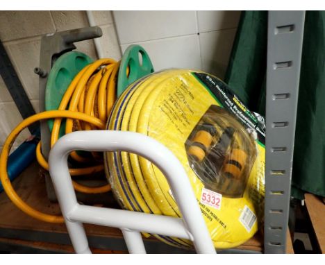 Hose reel and a new 25 metre hose. Not available for in-house P&amp;P 