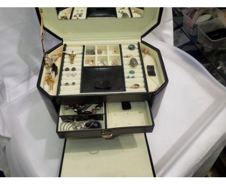 Black faux leather jewellery box with some jewellery including gold and silver examples. Not available for in-house P&amp;P 