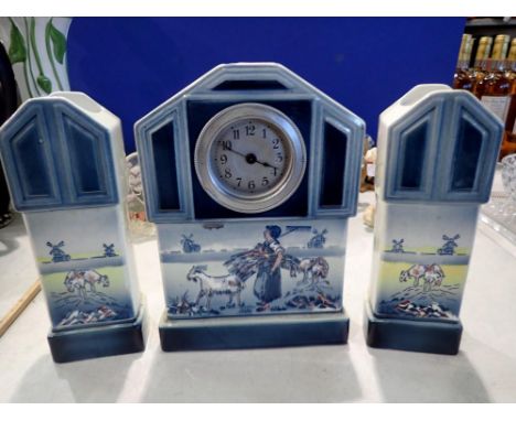 Continental ceramic clock garniture, working at lotting. Not available for in-house P&amp;P 