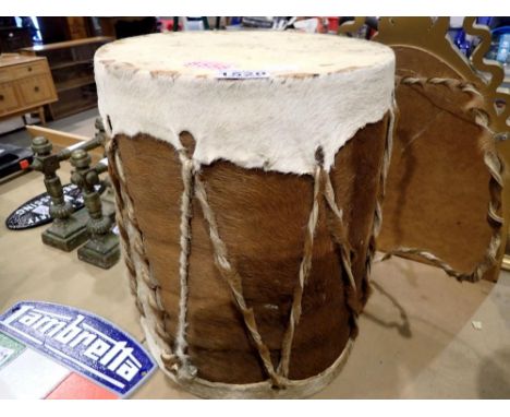 Cowhide tribal drum with twisted hide handle. Not available for in-house P&amp;P 