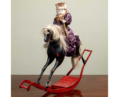 An old automaton in the form of a girl riding on the back of a rocking horse, signed beneath 'W. Summerball Mechanical Toys',