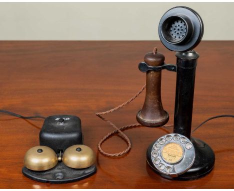 An old black-painted candlestick-type telephone with separate bell box, 32cm high, later converted for contemporary use. 