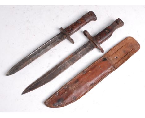 A Canadian Model 1910 Mk II Ross Rifle bayonet, having a 25cm single edged blade and two piece wooden grip, stamped to the po