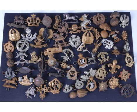 A collection of assorted military cap badges to include Baluch Regiment, Royal Army Ordinance Corps, Royal Northumberland Fus