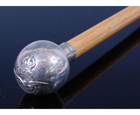 An R.A.F. swagger stick, having a silver plated terminal with regimental crest, 70cm.