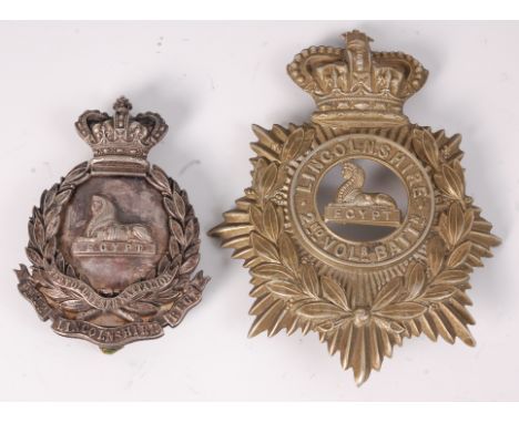 A white metal helmet plate for The Lincolnshire Regiment 2nd Volunteer Battalion, with four screw lugs stamped verso Hobson &