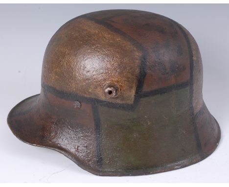 A German M16 steel helmet with camouflage colouring and leather liner.    Condition Report / Extra Information  No makers mar
