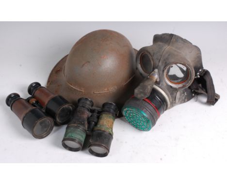 A WW II steel Brodie helmet with leather liner, together with a WW II gas mask marked P.B.C. Sep. 39, a pair of French Theatr