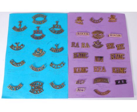 A collection of assorted shoulder titles and insignia of various regiments to include, Army service Corps, City of London Yeo