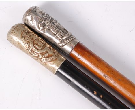 A military swagger stick having an ebonised shaft and plated mount with Suffolk Regiment crest, 70cm, together with one other