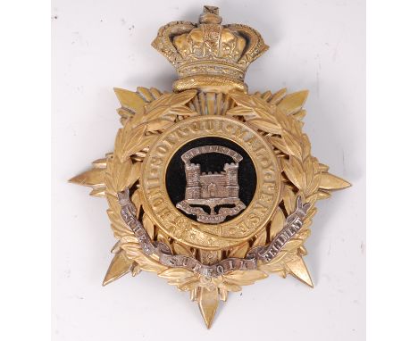 A Victorian Suffolk Regiment Officer's helmet plate of crowned star form, the black velvet centre with white metal castle emb
