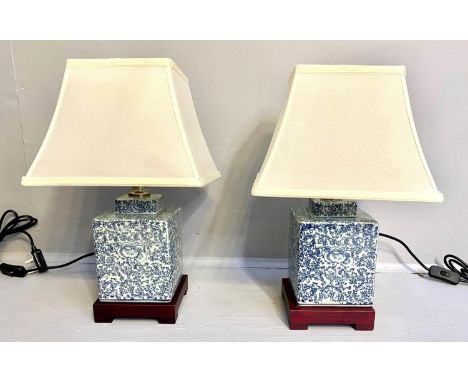 TABLE LAMPS, a pair, Chinese export style blue and white ceramic, with shades, 42cm x 28cm x 28cm. 