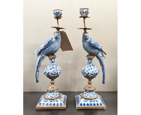 CANDELABRA, a pair, 48cm H, in the form of cockatoos, blue and white ceramic, gilt metal mounts. (2) 