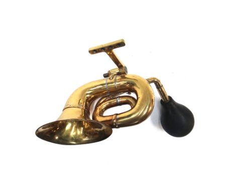 An early 20th century brass car horn, stamped 'Goliath'.