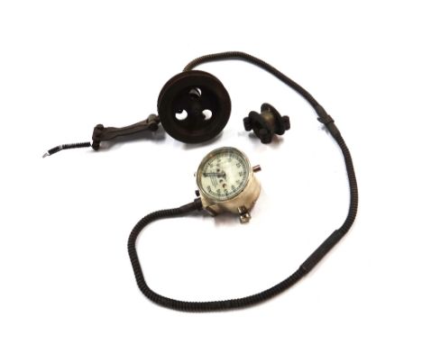A vintage 'Smiths' brass cased three and three quarter inch 0-60MPH speedometer, complete with flywheel fittings.