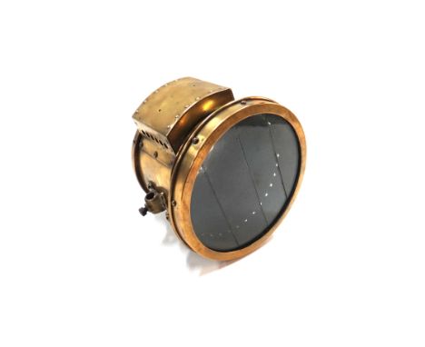 An early 20th century nine inch brass cased automobile light.