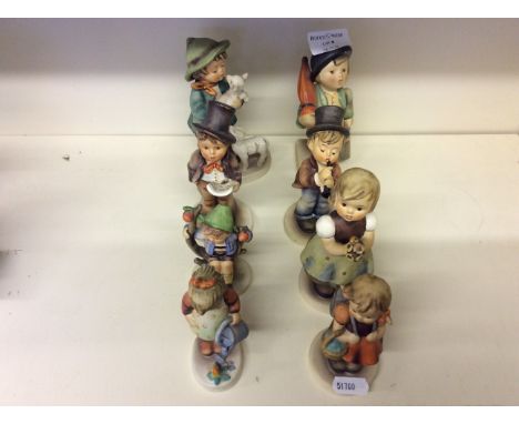 A selection of Goebel child figurines.