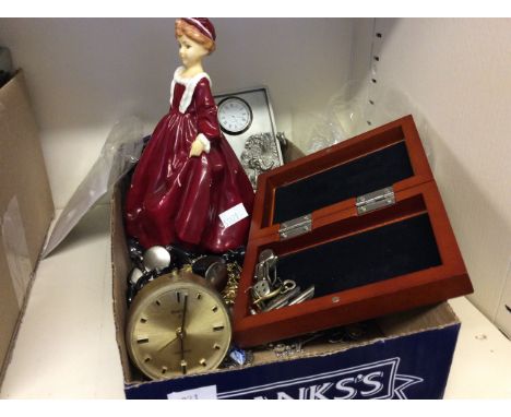 A box of assorted jewellery, Swiss eight alarm clock and painted hollow ceramic doll.