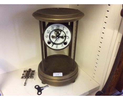 A brass framed mantle clock.