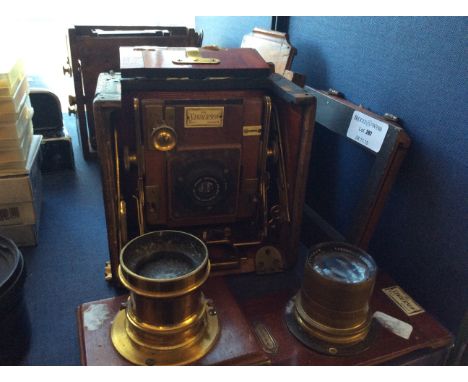 Lot to include a selection of Sanderson camera equipment including lenses, wooden cased camera bodies and plate holders.