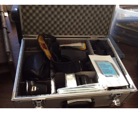 A case of camera equipment and cases from various brands, Starblitz, Contax, Sunpak etc.