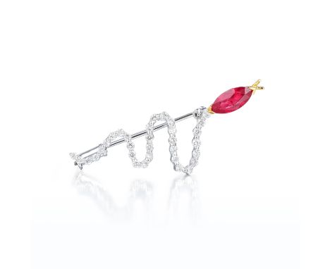 In the shape of a slithering snake, featuring a marquise-shaped ruby for the head, weighing approximately 0.94 carats, and 32