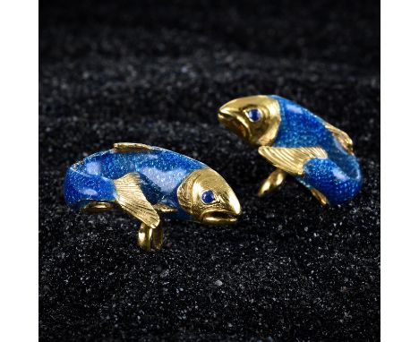 Crafted out of 18K yellow gold, with cornflower blue enamel scales covering the body and small sapphires for eyes; each top m