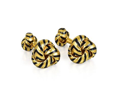 Designed as a pair of knot cufflinks, crafted out of 18K yellow gold, with black enamel stripes; cufflink tops measure 1.0 x 