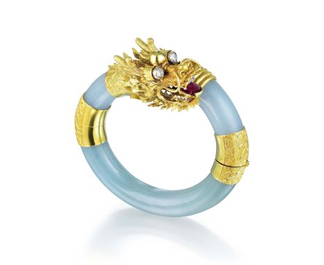 With the bangle crafted out of jade, and the dragon head, tail and links crafted out of 14K yellow gold, with the dragon head