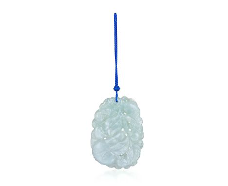 Designed as a carved jade pendant, with peach and floral motifs; measures 1-3/8 x 1-15/16 inches; weight 26.1 g. Property of 